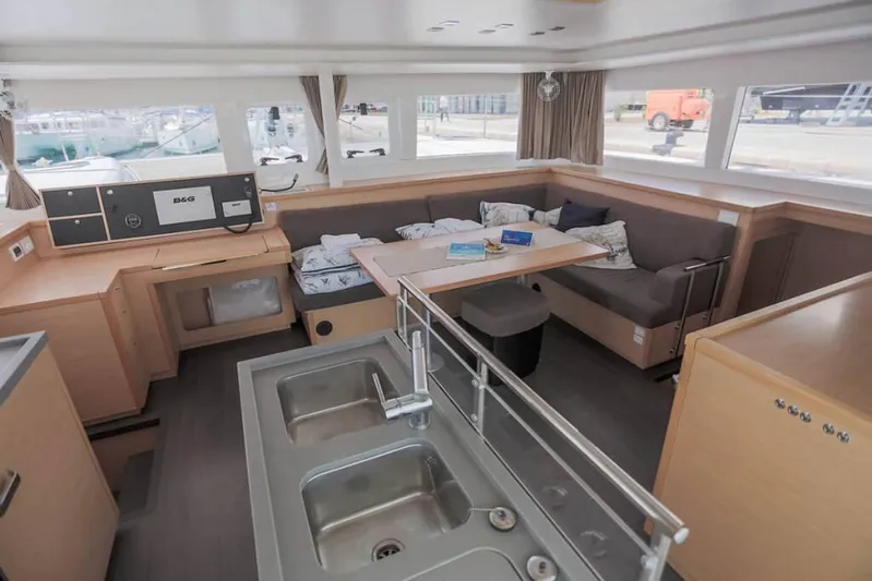  Yacht Photos Pics Interior of 2018 Lagoon 450 F catamaran with modern kitchen and cozy seating area.