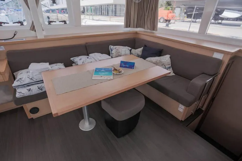  Yacht Photos Pics Interior of 2018 Lagoon 450 F catamaran with cozy seating and dining table.