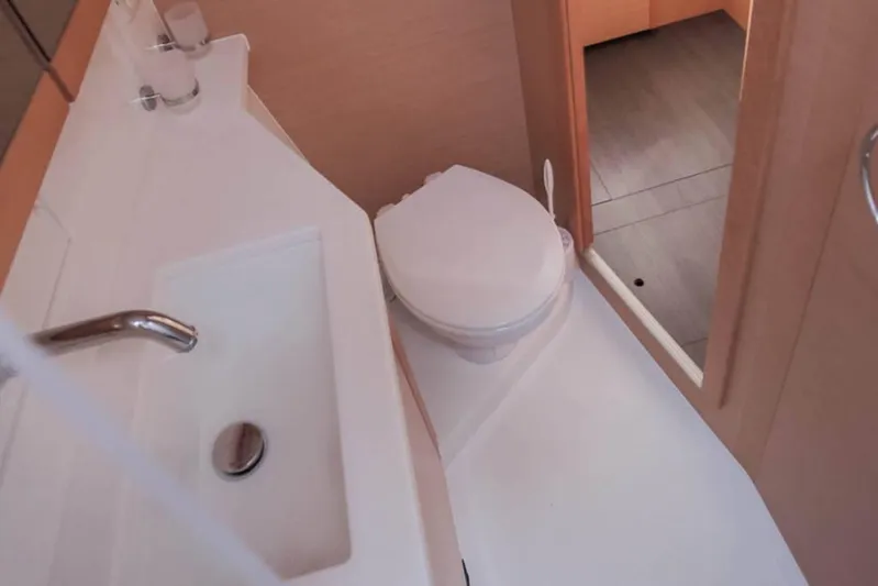  Yacht Photos Pics Bathroom interior of 2018 Lagoon 450 F yacht with sink and toilet.
