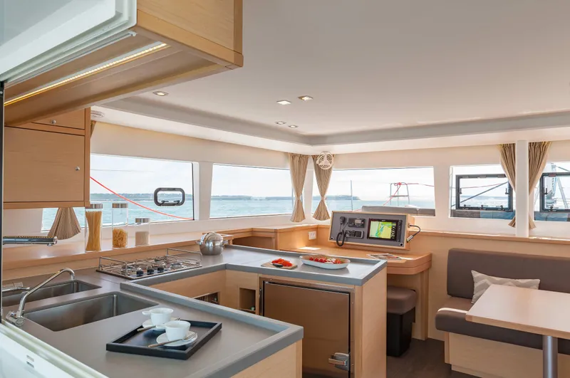  Yacht Photos Pics Interior of 2018 Lagoon 450 F catamaran with modern kitchen and ocean view.