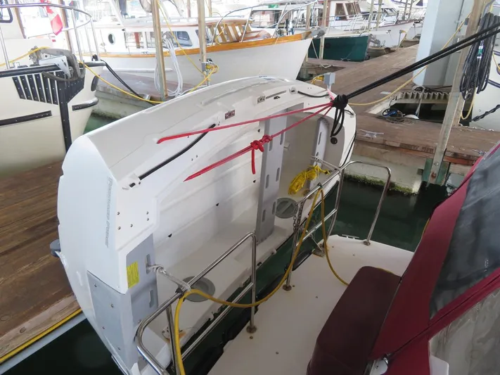 Then Again Yacht Photos Pics 2018 Ranger Tugs R-31 S boat stern view, docked with visible ropes and railings.
