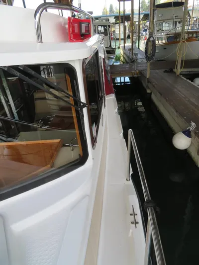 Then Again Yacht Photos Pics 2018 Ranger Tugs R-31 S docked, showcasing side deck and cabin details.