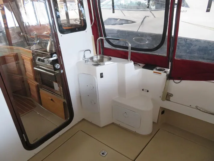 Then Again Yacht Photos Pics 2018 Ranger Tugs R-31 S interior with kitchenette and sink area.