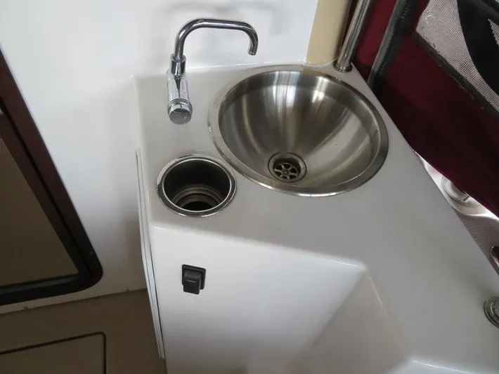 Then Again Yacht Photos Pics 2018 Ranger Tugs R-31 S boat sink with stainless steel basin and faucet.