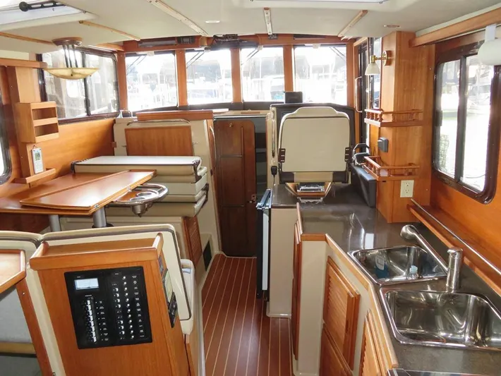Then Again Yacht Photos Pics Interior of 2018 Ranger Tugs R-31 S, featuring wood finishes and modern amenities.
