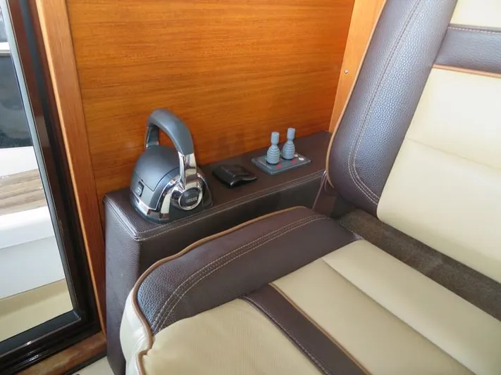Then Again Yacht Photos Pics 2018 Ranger Tugs R-31 S interior with leather seating and headphones.