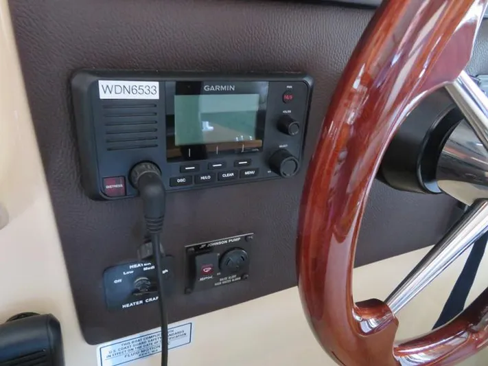 Then Again Yacht Photos Pics 2018 Ranger Tugs R-31 S helm with Garmin navigation system and wooden steering wheel.