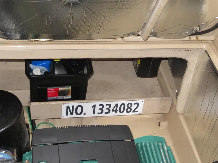 Then Again Yacht Photos Pics 2018 Ranger Tugs R-31 S interior with storage compartment and registration number 1334082.