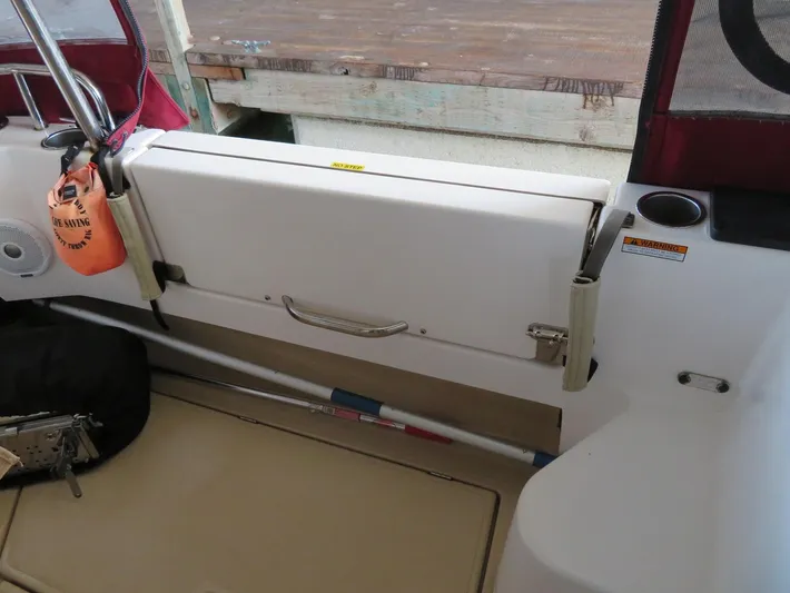 Then Again Yacht Photos Pics 2018 Ranger Tugs R-31 S boat interior with safety equipment and storage compartment.