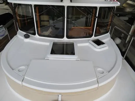 Then Again Yacht Photos Pics 2018 Ranger Tugs R-31 S boat deck with windows and hatches.