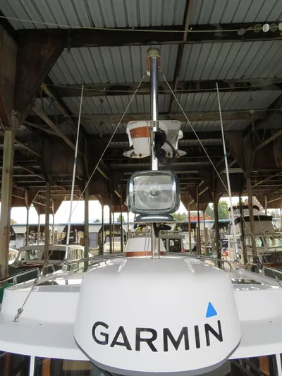 Then Again Yacht Photos Pics 2018 Ranger Tugs R-31 S with Garmin equipment under a covered dock.