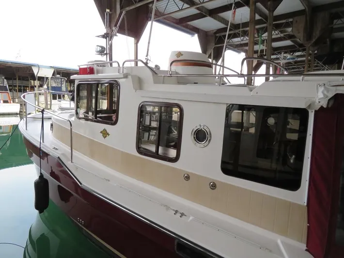 Then Again Yacht Photos Pics 2018 Ranger Tugs R-31 S boat docked in a marina, side view.