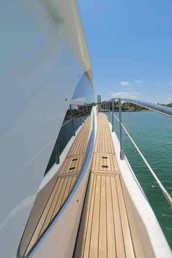 Bon Bon Yacht Photos Pics Azimut 55 yacht deck, 2020 model, cruising on clear blue waters under a sunny sky.