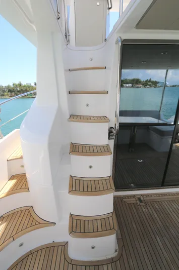 Bon Bon Yacht Photos Pics Staircase on 2020 Azimut 55 yacht with teak steps and ocean view.