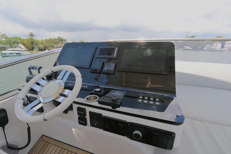 Bon Bon Yacht Photos Pics Cockpit of 2020 Azimut 55 yacht with modern navigation controls and steering wheel.