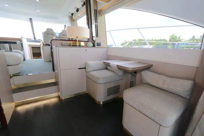 Bon Bon Yacht Photos Pics Luxurious interior of a 2020 Azimut 55 yacht with modern seating and elegant decor.