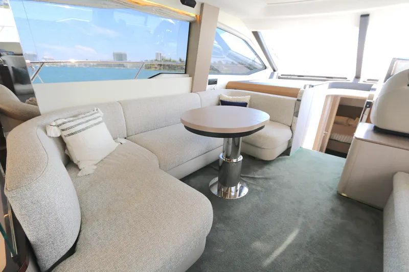 Bon Bon Yacht Photos Pics Luxurious interior of 2020 Azimut 55 yacht with plush seating and modern decor.