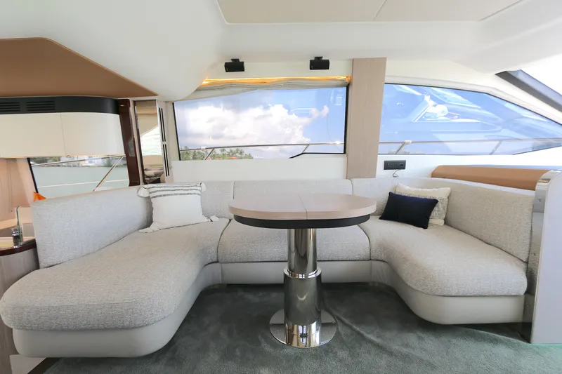 Bon Bon Yacht Photos Pics Luxurious interior of 2020 Azimut 55 yacht with elegant seating and table.