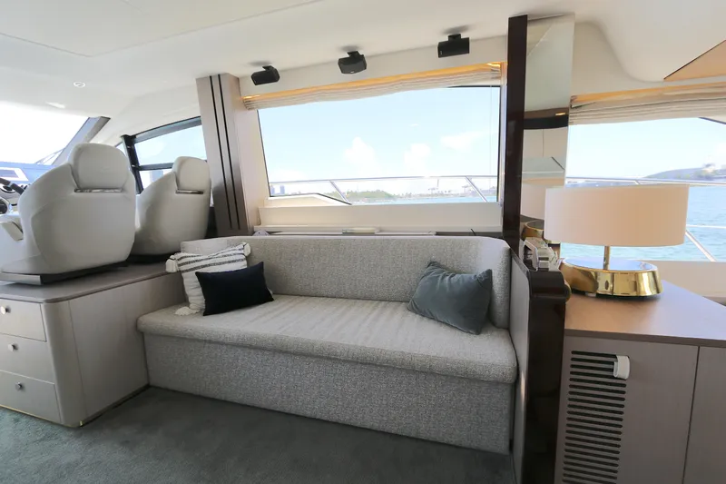 Bon Bon Yacht Photos Pics Luxurious interior of 2020 Azimut 55 yacht with elegant seating and scenic ocean view.