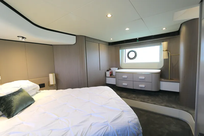 Bon Bon Yacht Photos Pics Luxurious bedroom interior of 2020 Azimut 55 yacht with modern design and elegant furnishings.