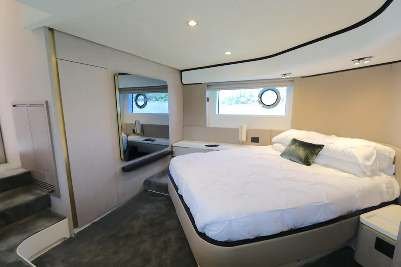 Bon Bon Yacht Photos Pics Luxurious bedroom interior of 2020 Azimut 55 yacht with modern design and porthole window.