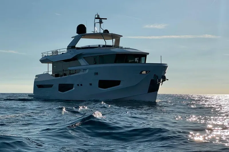 Maoria Yacht Photos Pics Luxury Numarine 26XP yacht cruising on open sea at sunset, 2021 model.