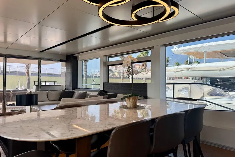Maoria Yacht Photos Pics Luxurious interior of 2021 Numarine 26XP yacht with elegant dining area and modern decor.