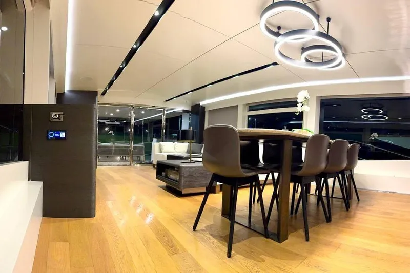 Maoria Yacht Photos Pics Luxurious interior of 2021 Numarine 26XP yacht with modern dining area and elegant lighting.