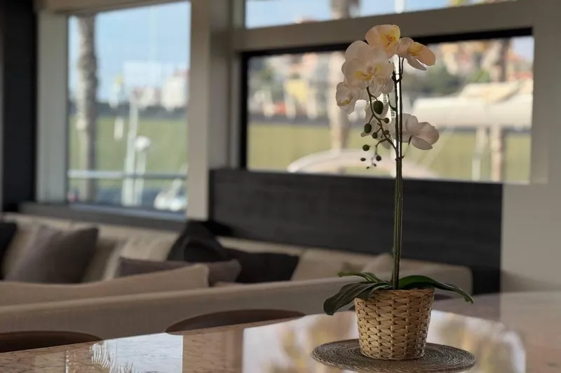 Maoria Yacht Photos Pics Elegant interior of 2021 Numarine 26XP yacht with orchid centerpiece.