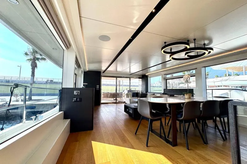 Maoria Yacht Photos Pics Luxurious interior of 2021 Numarine 26XP yacht with modern dining area and large windows.