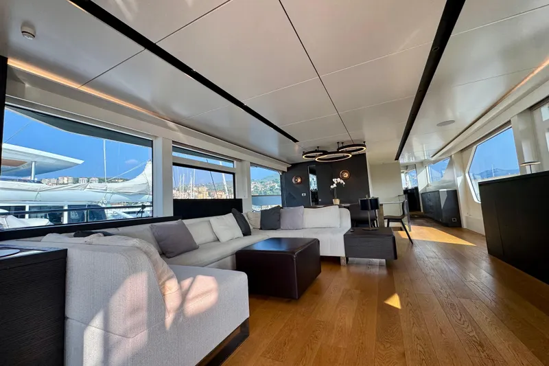 Maoria Yacht Photos Pics Luxurious interior of 2021 Numarine 26XP yacht with modern furnishings and panoramic windows.