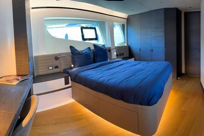 Maoria Yacht Photos Pics Luxurious bedroom interior of 2021 Numarine 26XP yacht with modern design and ambient lighting.