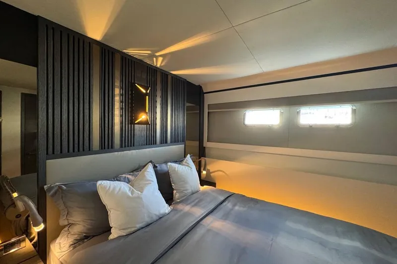 Maoria Yacht Photos Pics Luxurious bedroom interior of 2021 Numarine 26XP yacht with modern design elements.