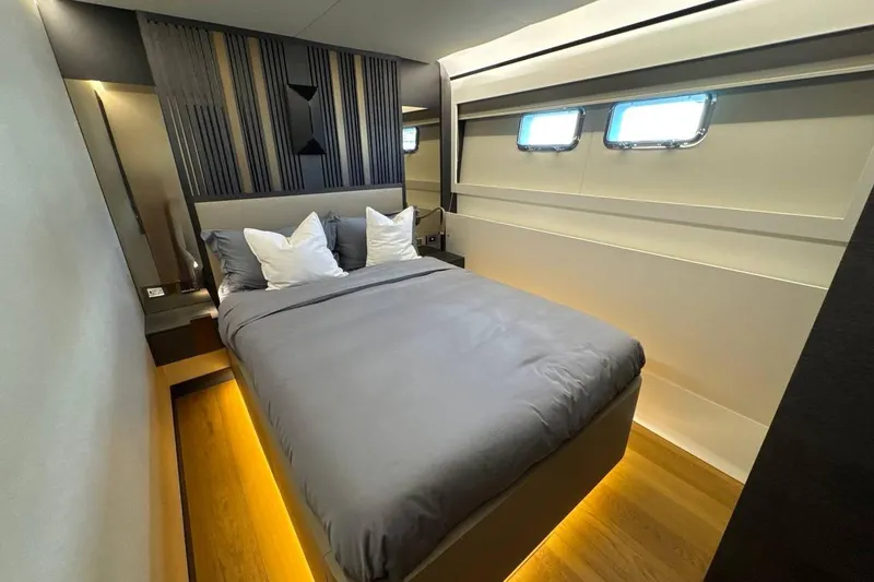 Maoria Yacht Photos Pics Luxurious bedroom interior of 2021 Numarine 26XP yacht with modern design and ambient lighting.