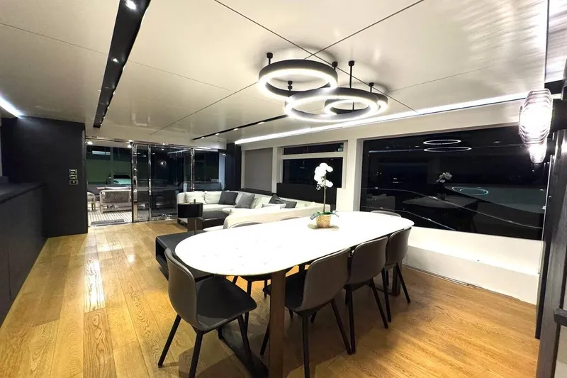 Maoria Yacht Photos Pics Luxurious interior of 2021 Numarine 26XP yacht with modern dining area and elegant lighting.