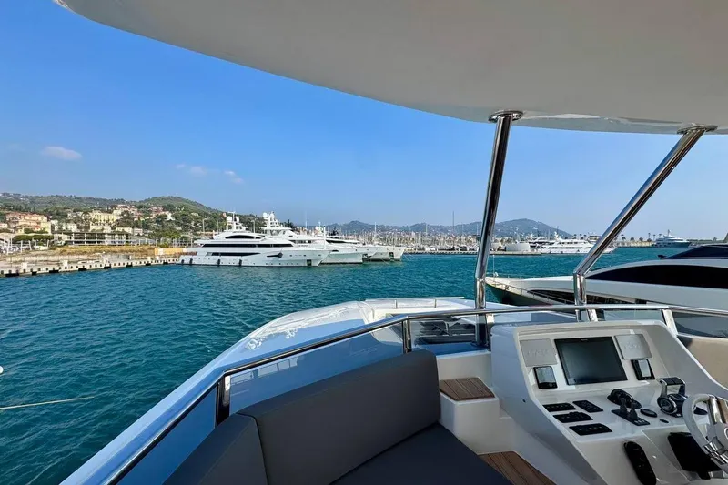 Maoria Yacht Photos Pics Luxury yacht Numarine 26XP 2021 docked in scenic marina view.
