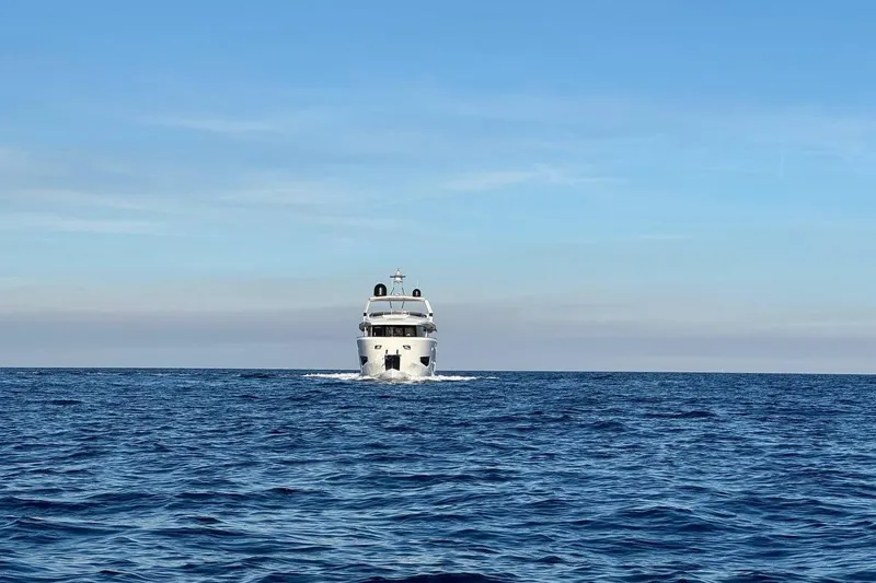 Maoria Yacht Photos Pics 2021 Numarine 26XP yacht cruising on open sea under clear blue sky.