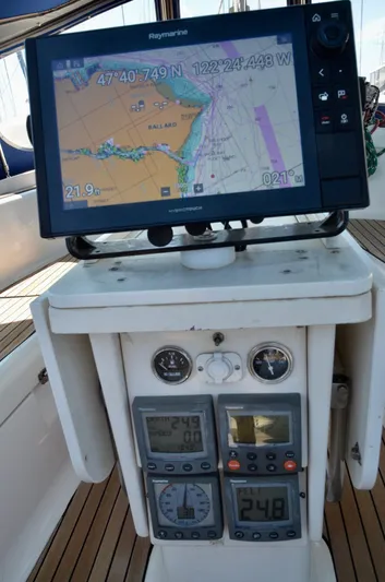 Footloose Yacht Photos Pics Navigation equipment on a 2003 Bavaria 49 sailboat, featuring GPS and control panels.