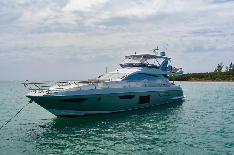 Gratitude Yacht Photos Pics Luxurious 2017 Azimut 72 Flybridge yacht anchored in serene turquoise waters.