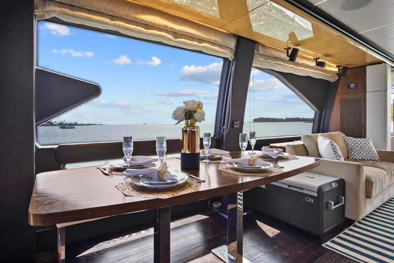 Gratitude Yacht Photos Pics Luxurious dining area on 2017 Azimut 72 Flybridge yacht with ocean view.