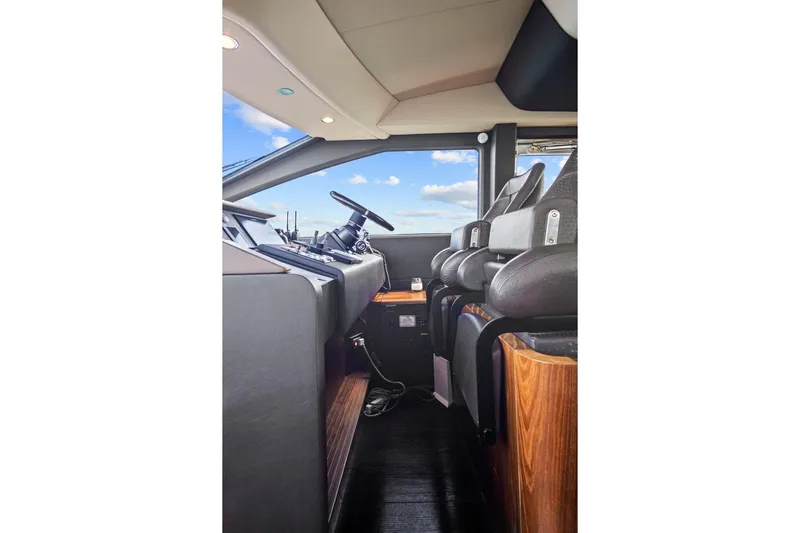 Gratitude Yacht Photos Pics Interior view of 2017 Azimut 72 Flybridge yacht cockpit with modern controls and seating.