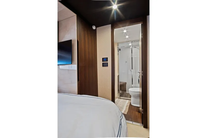 Gratitude Yacht Photos Pics Luxurious interior of 2017 Azimut 72 Flybridge yacht featuring modern bathroom and bedroom.