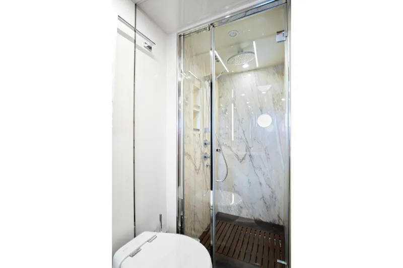 Gratitude Yacht Photos Pics Luxurious bathroom in 2017 Azimut 72 Flybridge yacht with marble shower and modern fixtures.