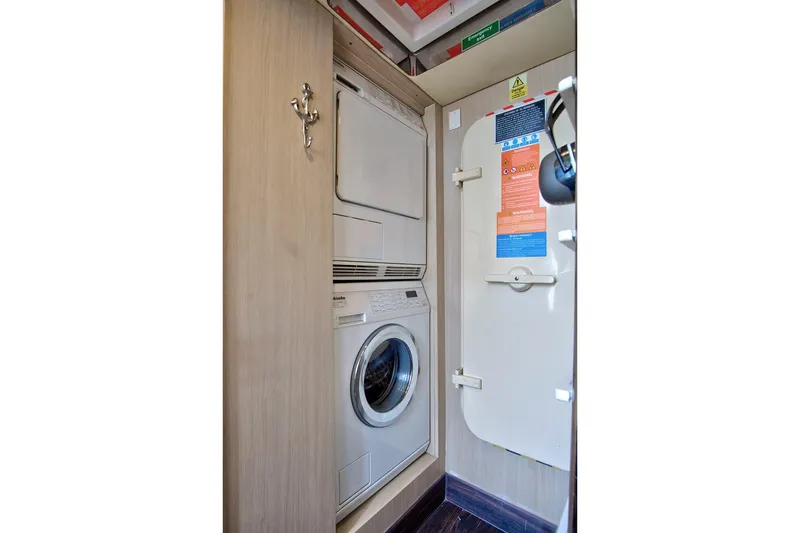 Gratitude Yacht Photos Pics Laundry area on 2017 Azimut 72 Flybridge yacht with washer and dryer.