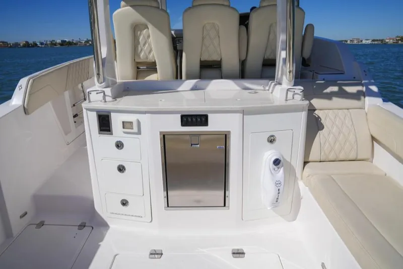  Yacht Photos Pics 2019 Regal 33 SAV boat interior with seating and storage compartments.