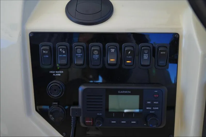  Yacht Photos Pics Control panel of a 2019 Regal 33 SAV boat with Garmin display and switches.