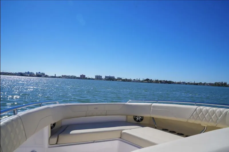  Yacht Photos Pics 2019 Regal 33 SAV boat interior with ocean view under clear blue sky.