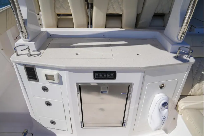  Yacht Photos Pics 2019 Regal 33 SAV boat interior with storage compartments and seating.