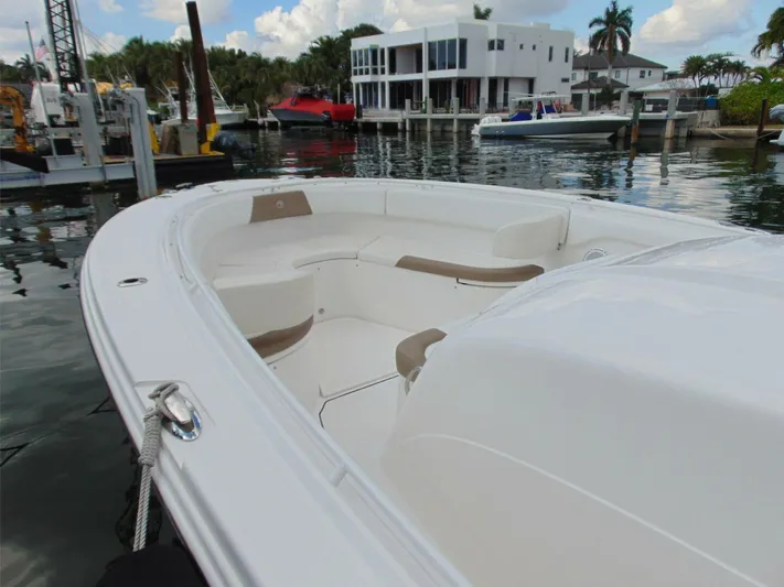  Yacht Photos Pics Edgewater 368 CC 2016 boat docked in a marina with waterfront homes.