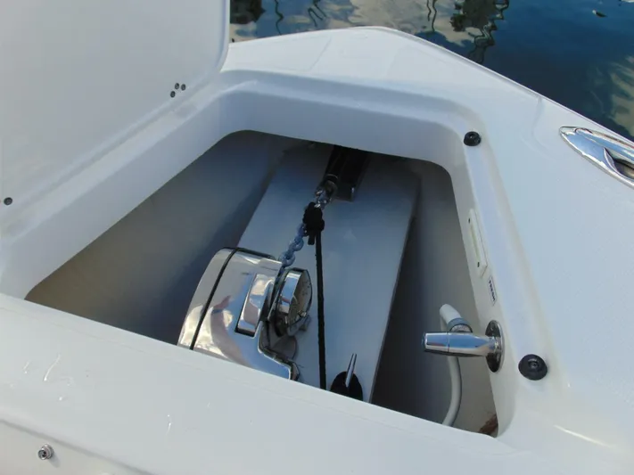  Yacht Photos Pics Anchor compartment of 2016 Edgewater 368 CC boat, featuring a stainless steel anchor system.